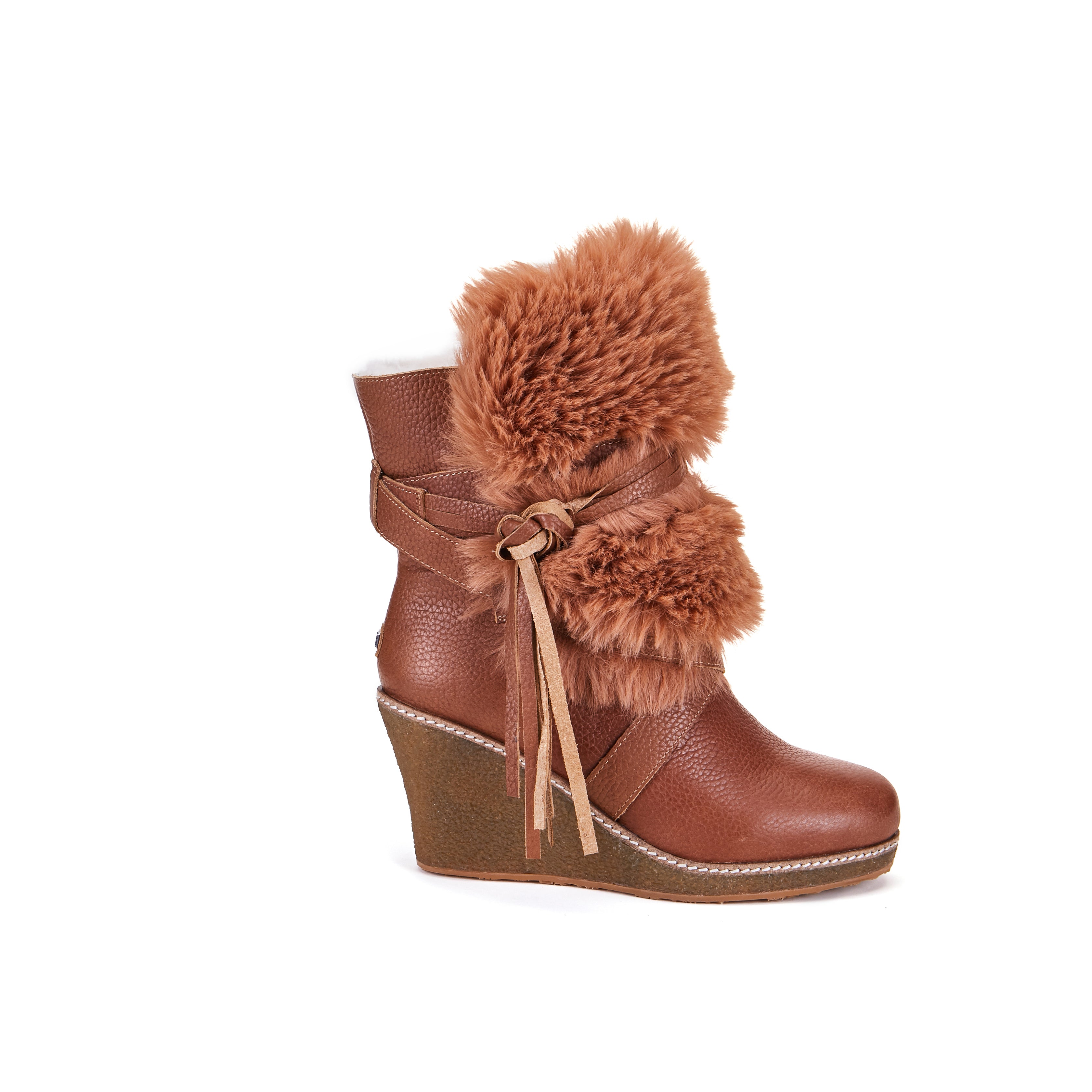 Montreal is Luxe s stylish high wedge sheepskin boot. Ankle height