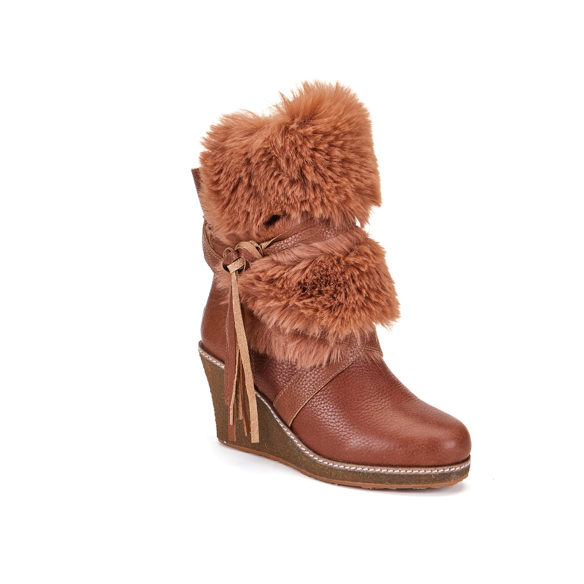 Montreal is Luxe s stylish high wedge sheepskin boot. Ankle height