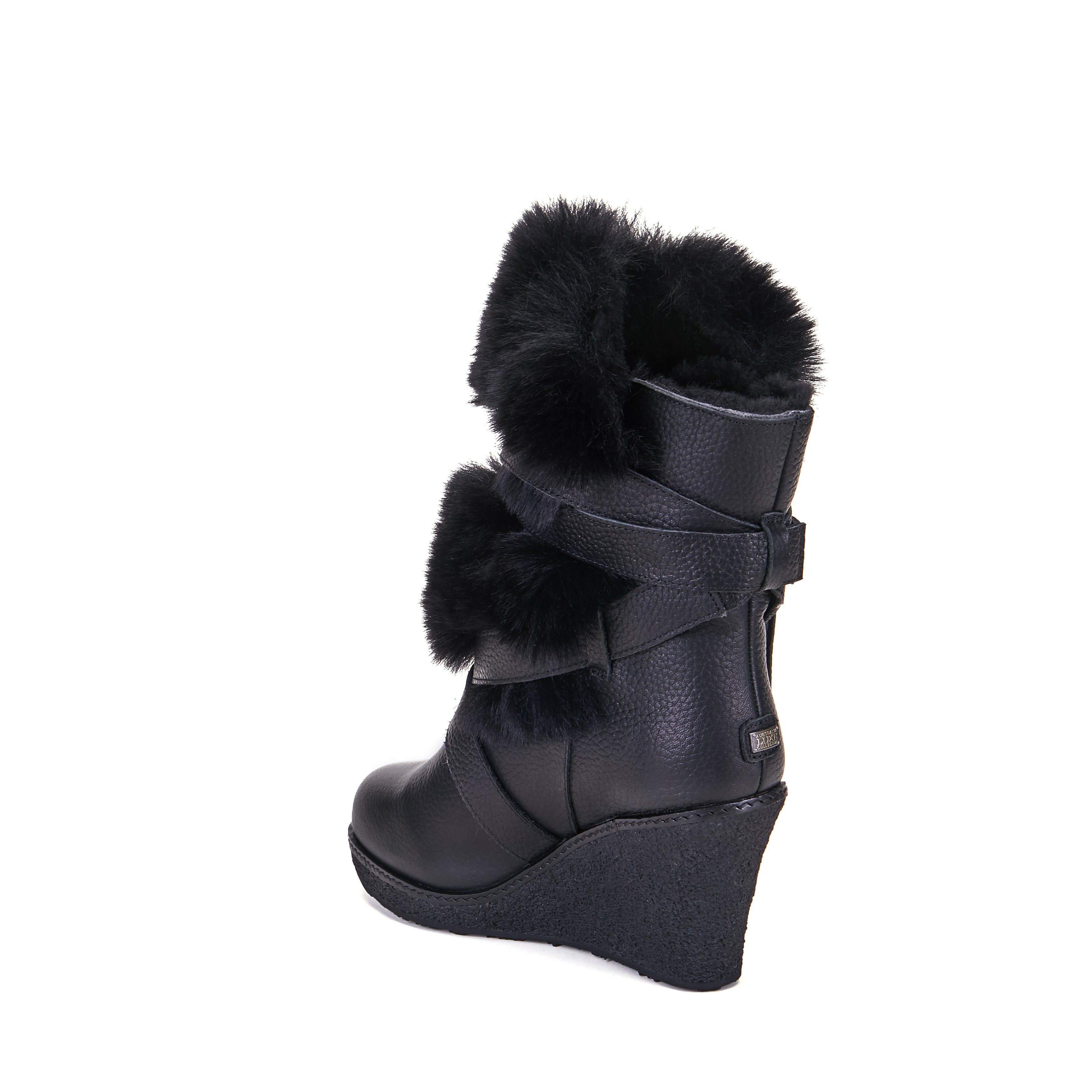 Montreal is Luxe s stylish high wedge sheepskin boot. Ankle height